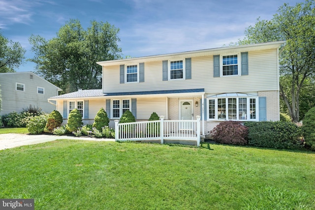 2621 Dartmouth Woods Rd, Wilmington, DE 19810 - view of front of home featuring brick siding and a front yard