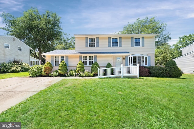 2621 Dartmouth Woods Rd, Wilmington, DE 19810 - view of front of home with a front yard and brick siding