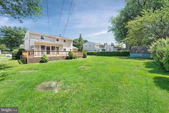 2621 Dartmouth Woods Rd, Wilmington, DE 19810 - view of grassy yard with a wooden deck and a storage shed