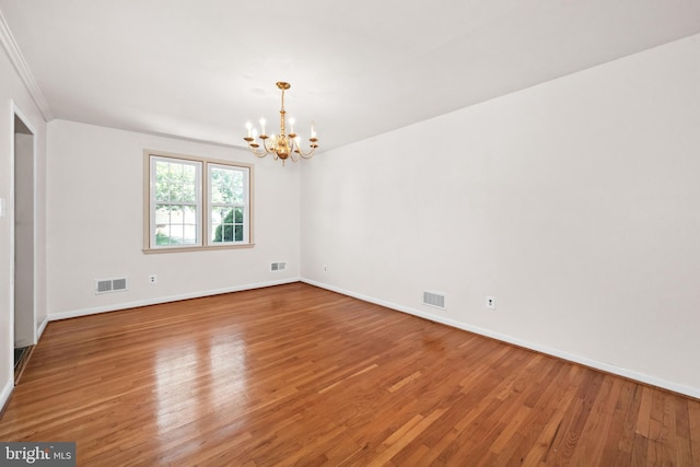 2621 Dartmouth Woods Rd, Wilmington, DE 19810 - empty room featuring a chandelier and wood finished floors