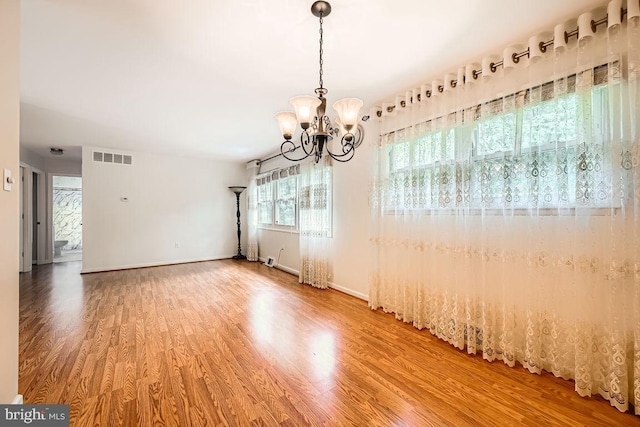 231 Candytuft Rd, Reisterstown, MD 21136 - empty room featuring wood finished floors and a chandelier
