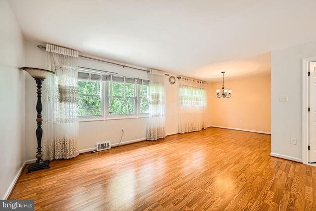 231 Candytuft Rd, Reisterstown, MD 21136 - unfurnished room with a chandelier and wood finished floors