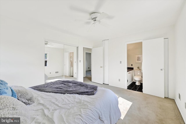 127 W Chestnut Hill Ln, Reisterstown, MD 21136 - bedroom featuring carpet, connected bathroom, a ceiling fan, and two closets
