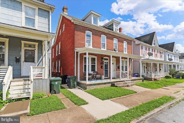 432 Mcdowell Ave, Hagerstown, MD 21740 - multi unit property with covered porch, brick siding, and a chimney