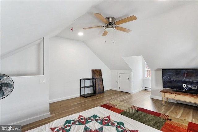 432 Mcdowell Ave, Hagerstown, MD 21740 - bedroom with wood finished floors, vaulted ceiling, a baseboard heating unit, and a ceiling fan