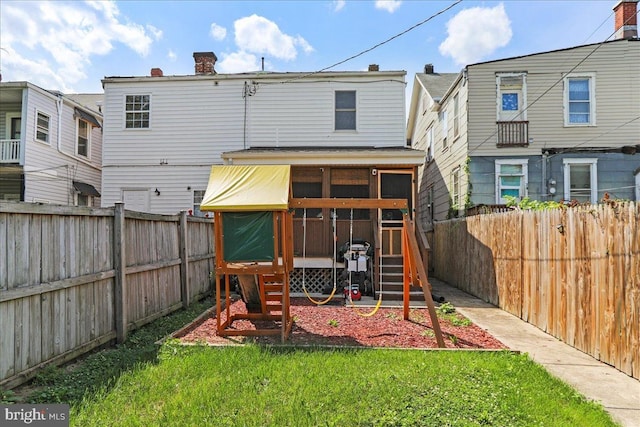 432 Mcdowell Ave, Hagerstown, MD 21740 - back of property with a chimney, a sunroom, and a fenced backyard