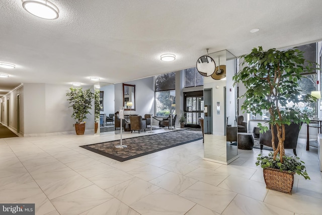 2059 Huntington Ave Unit 1406, Alexandria, VA 22303 - building lobby with a textured ceiling and a wall of windows