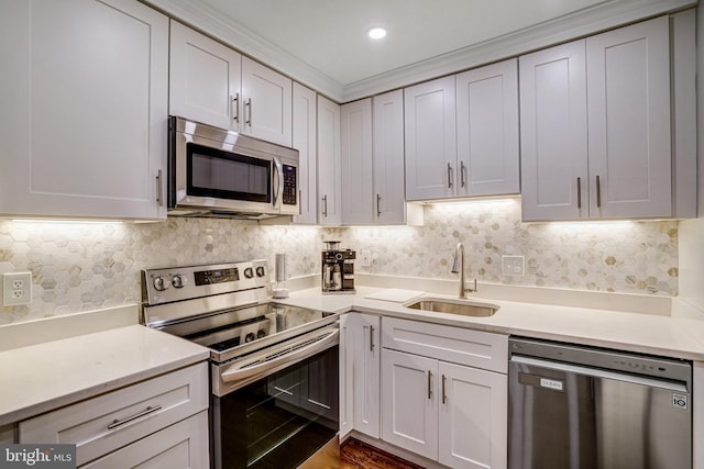 644 S Columbus St, Alexandria, VA 22314 - kitchen featuring stainless steel appliances, light countertops, backsplash, and crown molding