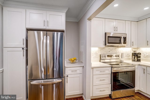 644 S Columbus St, Alexandria, VA 22314 - kitchen with appliances with stainless steel finishes, light countertops, white cabinets, backsplash, and crown molding
