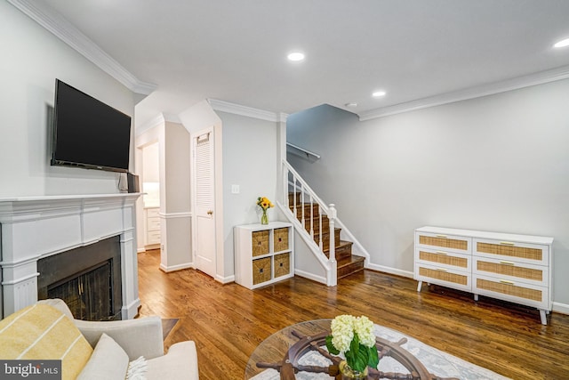 644 S Columbus St, Alexandria, VA 22314 - living area with stairway, crown molding, wood finished floors, a fireplace, and recessed lighting
