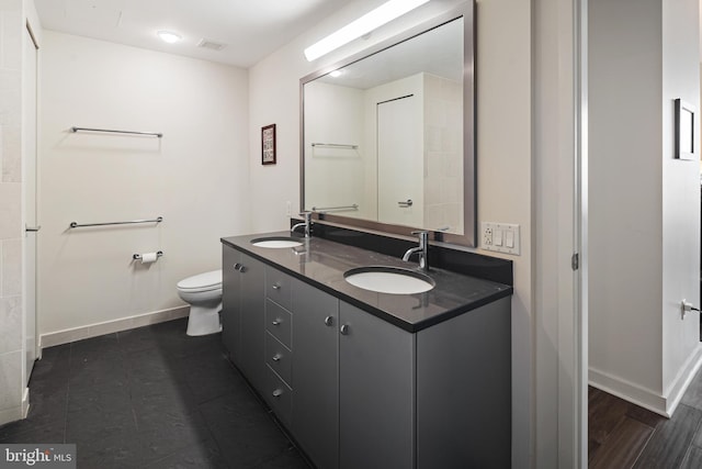 2101 Market St Unit 2801, Philadelphia, PA 19103 - bathroom with double vanity and baseboards