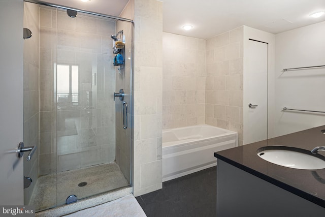 2101 Market St Unit 2801, Philadelphia, PA 19103 - bathroom with a stall shower, tile patterned flooring, vanity, and a tub to relax in