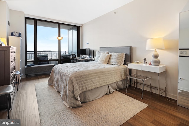 2101 Market St Unit 2801, Philadelphia, PA 19103 - bedroom featuring access to exterior, floor to ceiling windows, wood finished floors, and an office area