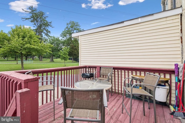 3170 Merriel Ave, Camden, NJ 08105 - wooden terrace with outdoor dining area and a lawn