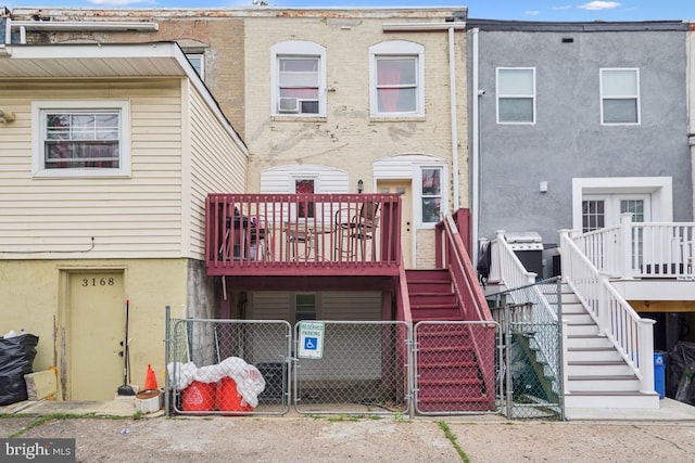 3170 Merriel Ave, Camden, NJ 08105 - back of house with a gate, stairway, a wooden deck, and stucco siding