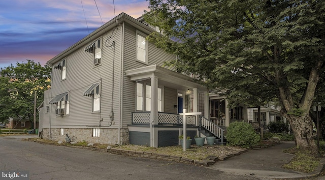 32 W Willow St, Carlisle, PA 17013 - property exterior at dusk featuring covered porch