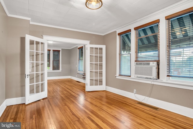 32 W Willow St, Carlisle, PA 17013 - empty room with french doors, crown molding, plenty of natural light, wood finished floors, and cooling unit