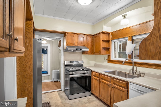 32 W Willow St, Carlisle, PA 17013 - kitchen with stainless steel appliances, radiator, under cabinet range hood, open shelves, and crown molding