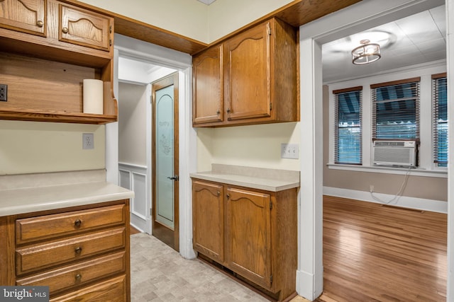 32 W Willow St, Carlisle, PA 17013 - kitchen featuring cooling unit, light countertops, brown cabinets, and open shelves