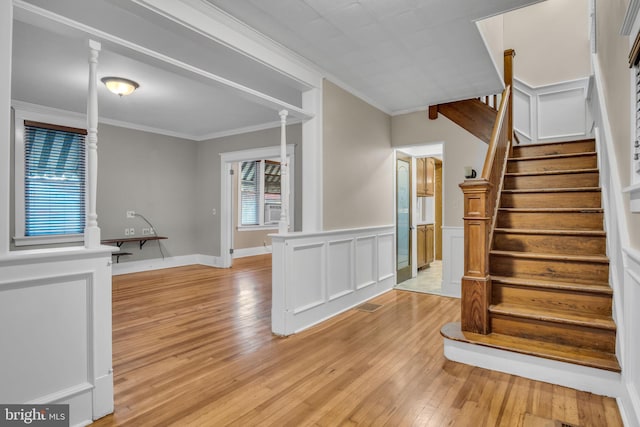 32 W Willow St, Carlisle, PA 17013 - stairs featuring hardwood / wood-style flooring, crown molding, a wainscoted wall, and cooling unit