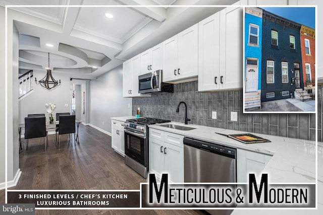 1715 E Oliver St, Baltimore, MD 21213 - kitchen featuring appliances with stainless steel finishes, coffered ceiling, decorative backsplash, beam ceiling, and a chandelier
