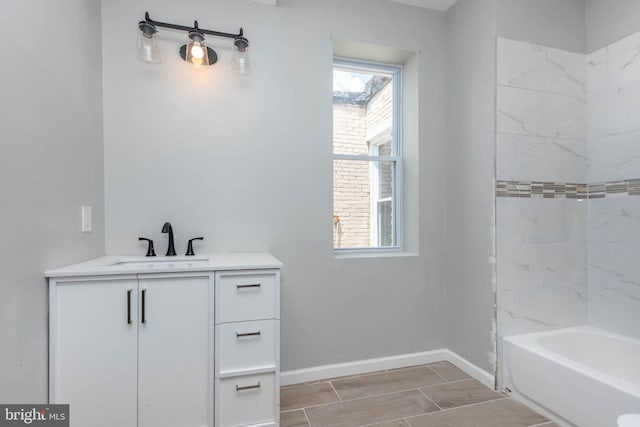 1715 E Oliver St, Baltimore, MD 21213 - full bathroom with vanity, plenty of natural light, bathing tub / shower combination, and wood finish floors