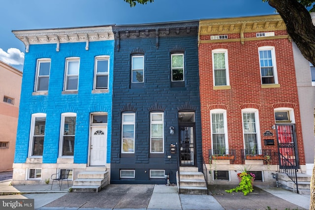 1715 E Oliver St, Baltimore, MD 21213 - multi unit property featuring entry steps and brick siding