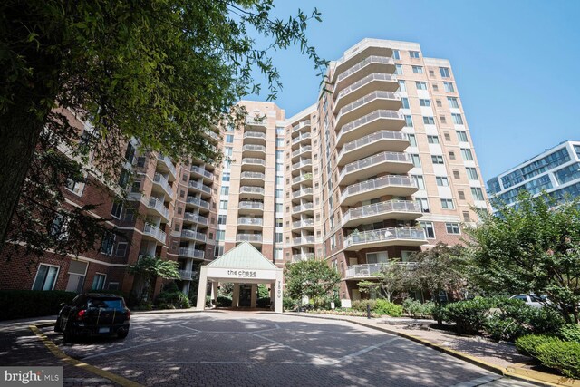 7500 Woodmont Ave Unit S609, Bethesda, MD 20814 - view of apartment building / complex with uncovered parking