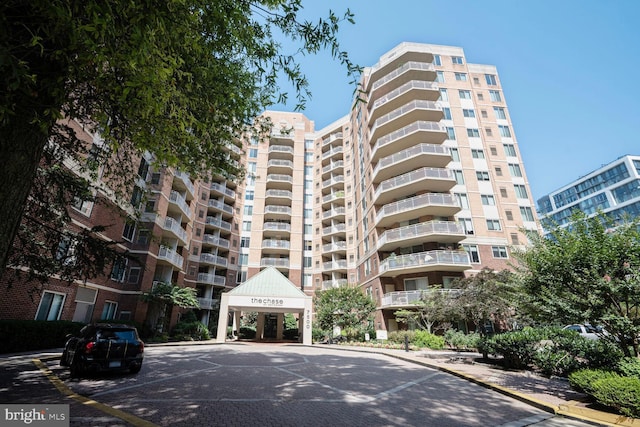 7500 Woodmont Ave Unit S609, Bethesda, MD 20814 - view of apartment building / complex featuring uncovered parking