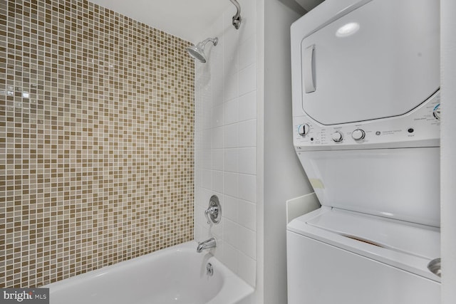 7500 Woodmont Ave Unit S609, Bethesda, MD 20814 - bathroom featuring stacked washing machine and dryer and bathing tub / shower combination