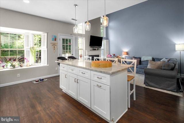 420 Fairview Way, New Hope, PA 18938 - kitchen featuring open floor plan, a kitchen bar, white cabinetry, and dark wood finished floors