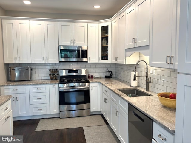 420 Fairview Way, New Hope, PA 18938 - kitchen featuring appliances with stainless steel finishes, white cabinetry, dark wood-style floors, recessed lighting, and glass insert cabinets