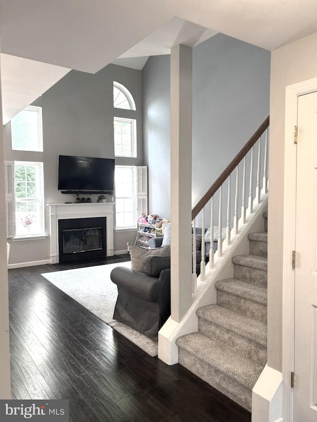 420 Fairview Way, New Hope, PA 18938 - living room featuring plenty of natural light, hardwood / wood-style flooring, stairway, a high ceiling, and a fireplace with flush hearth
