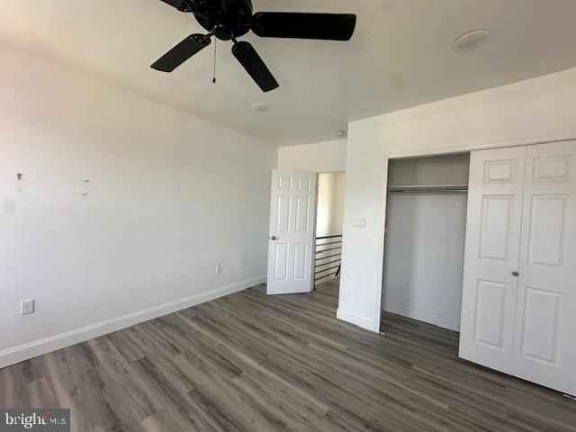 2521 N 12th St, Philadelphia, PA 19133 - unfurnished bedroom with a closet, wood finished floors, and ceiling fan