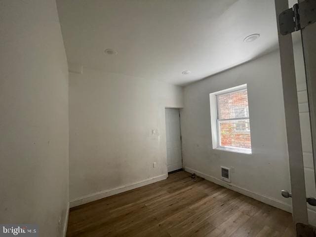 2521 N 12th St, Philadelphia, PA 19133 - empty room featuring wood finished floors and baseboards