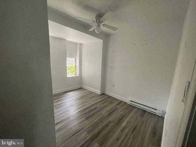 2521 N 12th St, Philadelphia, PA 19133 - unfurnished room with a baseboard heating unit, a ceiling fan, and wood finished floors