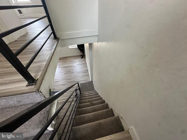 2521 N 12th St, Philadelphia, PA 19133 - stairs featuring wood finished floors and baseboards