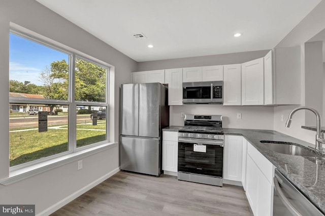 3 Villanova Ct, Sicklerville, NJ 08081 - kitchen featuring stainless steel appliances, dark stone counters, white cabinets, light wood finished floors, and recessed lighting