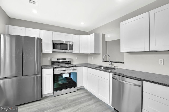 3 Villanova Ct, Sicklerville, NJ 08081 - kitchen featuring stainless steel appliances, white cabinetry, light wood finished floors, and recessed lighting