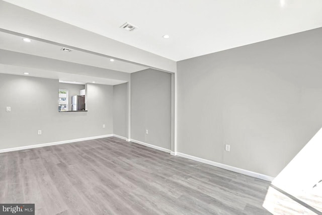 3 Villanova Ct, Sicklerville, NJ 08081 - below grade area featuring freestanding refrigerator, recessed lighting, and wood finished floors