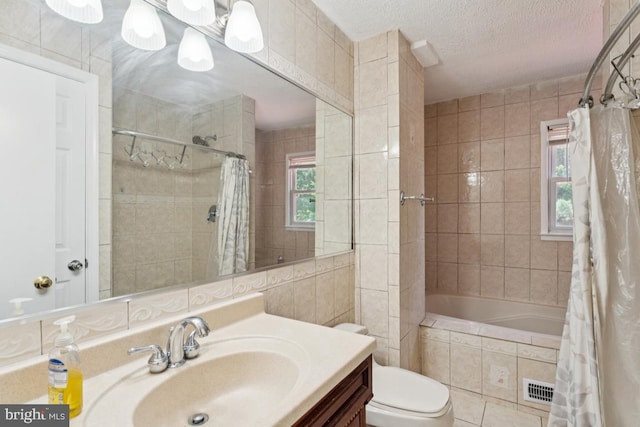 9405 Loughran Rd, Fort Washington, MD 20744 - bathroom featuring vanity, tiled shower / bath, and a textured ceiling