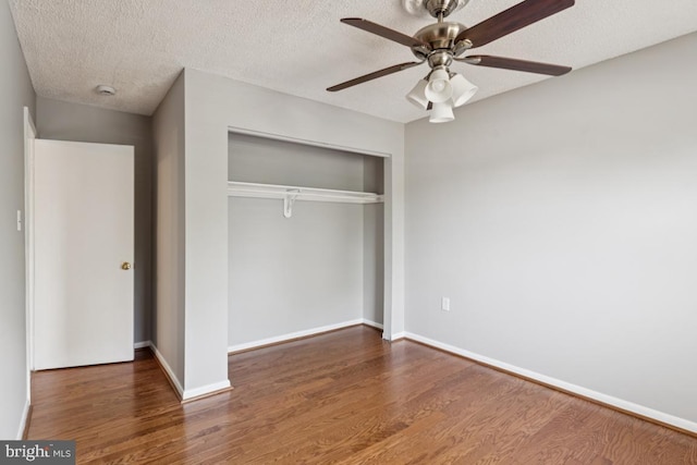 9405 Loughran Rd, Fort Washington, MD 20744 - unfurnished bedroom featuring a closet, wood finished floors, a textured ceiling, and a ceiling fan
