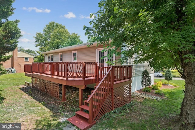 9405 Loughran Rd, Fort Washington, MD 20744 - rear view of house with a deck, a lawn, and stairs