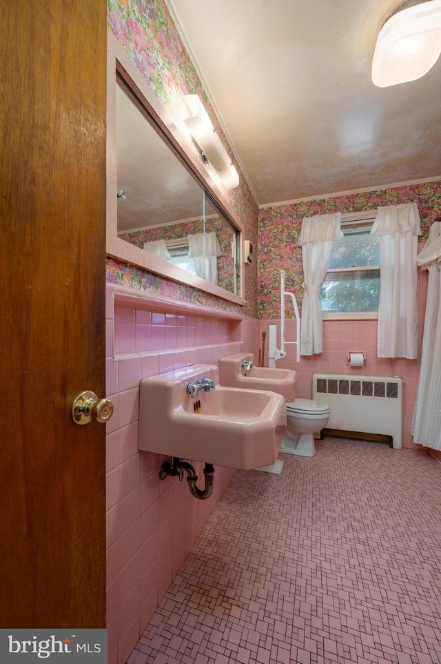 3221 Union Ave, Pennsauken, NJ 08109 - bathroom with radiator, tile walls, wallpapered walls, and wainscoting