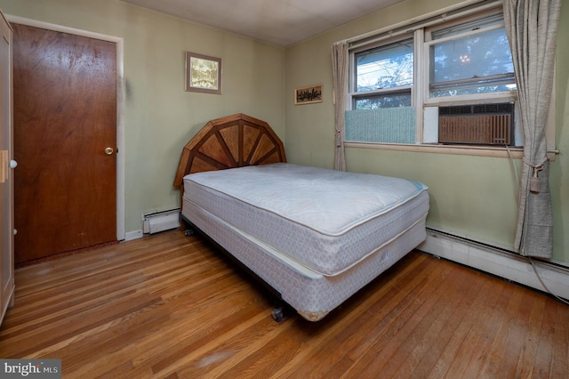 3221 Union Ave, Pennsauken, NJ 08109 - bedroom with hardwood / wood-style flooring, a baseboard heating unit, and cooling unit