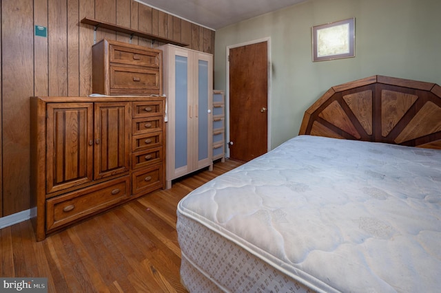 3221 Union Ave, Pennsauken, NJ 08109 - bedroom featuring dark wood-style flooring and wood walls