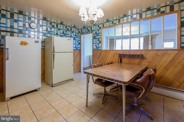 3221 Union Ave, Pennsauken, NJ 08109 - dining room with a chandelier, light tile patterned floors, a baseboard radiator, and wallpapered walls