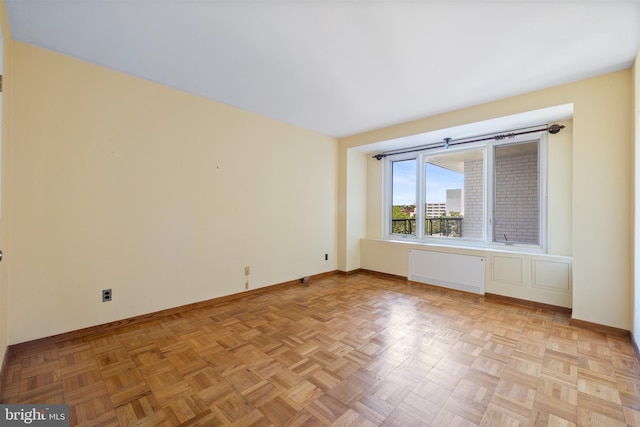 2475 Virginia Ave NW Unit 600, Washington, DC 20037 - empty room with radiator and baseboards