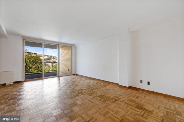 2475 Virginia Ave NW Unit 600, Washington, DC 20037 - spare room with baseboards and a wall of windows