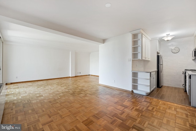 2475 Virginia Ave NW Unit 600, Washington, DC 20037 - kitchen with open shelves, stainless steel appliances, white cabinetry, and open floor plan